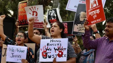 Group of women holding placards protest against the rape and murder of a trainee doctor in India's Kolkata city