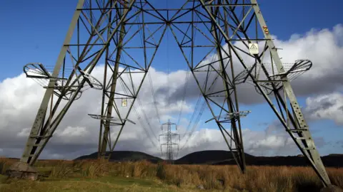 A view of the electricity pylons by the Ffos-Y-Fran opencast coal mine in Merthyr Tydfil, Wales.