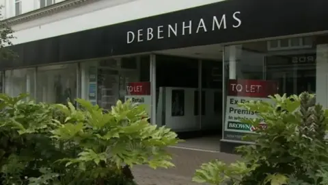 The outside of the former Debenhams store in King's Lynn, which has To Let signs in the window.