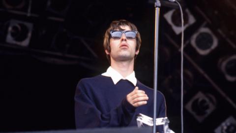 Liam Gallagher on stage at Glastonbury in 1994