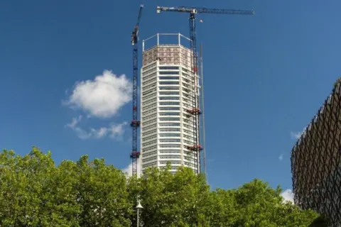Paradise Birmingham The Octagon is pictured with trees in the foreground and a building to the right of the photo