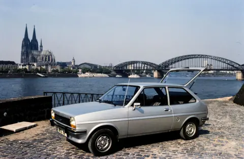 LAT Images/Getty Images Ford Fiesta L with Cologne Cathedral in background during the Automotive 1976 on January 01, 1976. (Photo by LAT Images)