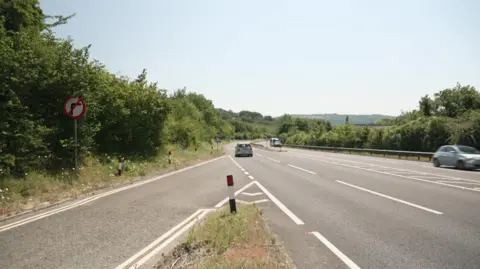 A slip road onto a dual carriageway is pictured.