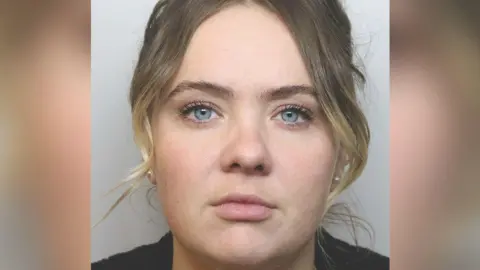 Mugshot of Molly Breen who has fair hair tied back and blue eyes