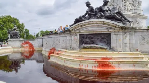 Fake blood is seen at the Victoria Memorial during the protest. 