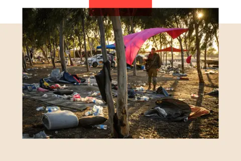 Getty Images Members of the security forces search for identification and personal effects at the Nova Music Festival site