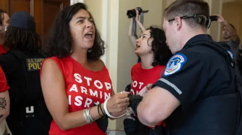 Pro-Palestinian EPA protesters were dispersed by Capitol Police as they demonstrated at the Cannon House Office Building on the eve of Benjamin Netanyahu's visit.
