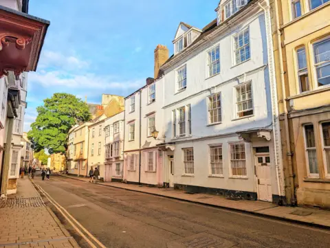 Lucie Johnson A quiet street in Oxford with shadows over the buildings