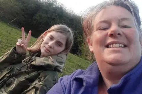 Family handout Emily Carter on the right wearing a purple fleece and Rhianan on the left wearing army camouflage