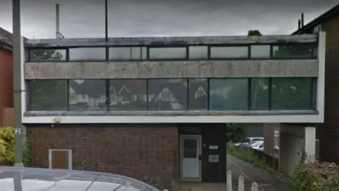 A grey building. 