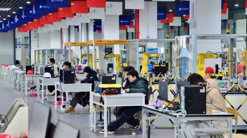 Students learning robotics at the Hangzhou Technician Institute.
