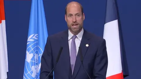 Prince William is speaking on stage.