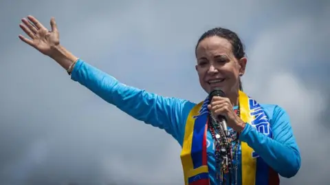 EPA Opposition leader Maria Corina Machado speaks to supporters during a caravan to promote the vote for the presidential candidate of the main opposition alliance in Venezuela, Edmundo Gonzalez Urrutia, ahead of the presidential elections, in Maturin, Venezuela, 20 July 2024.