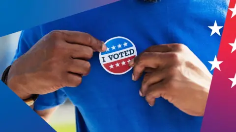 A close-up of a man putting a sticker on his shirt that says 'I voted'