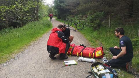 Injured cyclist being treated