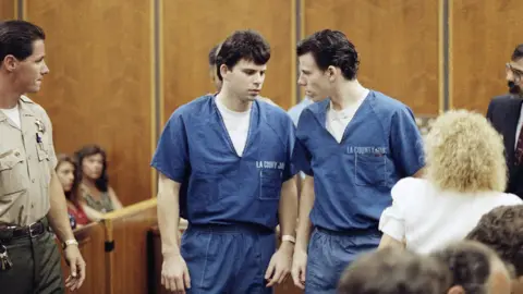 Lyle, left, and Erik Menendez leave courtroom in Santa Monica in 1990, after a judge ruled that conversations between the two brothers and their psychologist can be used as evidence in their murder case