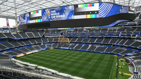 Getty Images A very large stadium with blue World Cup livery. It is empty.