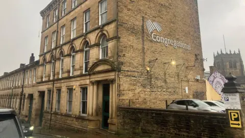 A general view of a four-storey 19th Century building in Bradford.