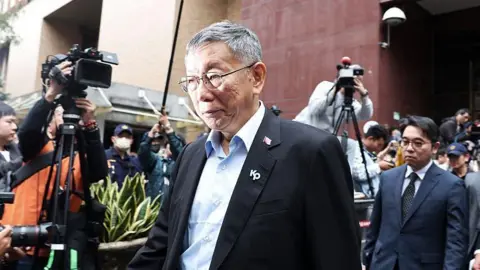 Former Taipei mayor and 2024 presidential candidate Ko Wen-je leaves the Taipei District Court in Taipei 
