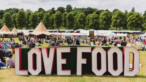 A huge sign spelling "LOVE FOOD" in the Quarry park in Shrewsbury