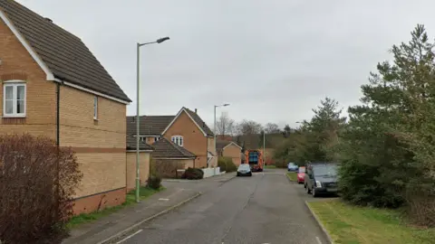 A view of Granary Road in Newmarket. Cars are parked on the side of the road.