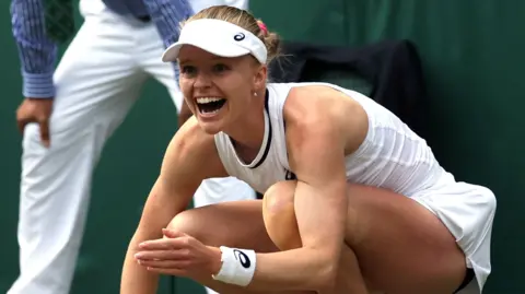 Harriet Dart celebrates beating Katie Boulter in the Wimbledon second round
