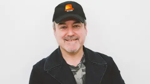  Laura Palmer/BBC David Arnold smiling at the camera