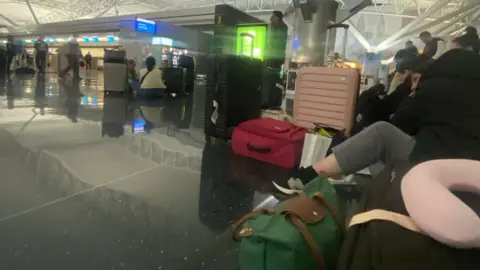 Luggage placed by British airway passengers around the terminal of John F. Kennedy Airport in New York on Friday morning