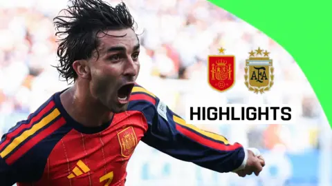 Ferran Torres runs and shouts to celebrate scoring for Spain in the World Cup final.