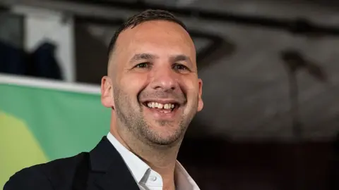 Getty Images Green Party leader Zack Polanski addresses the press conference on April 9, 2026 in London, England. 