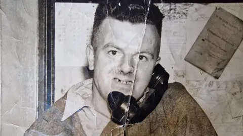 Blaenau Gwent Council Billy on the telephone, the picture wrinkled showing its age