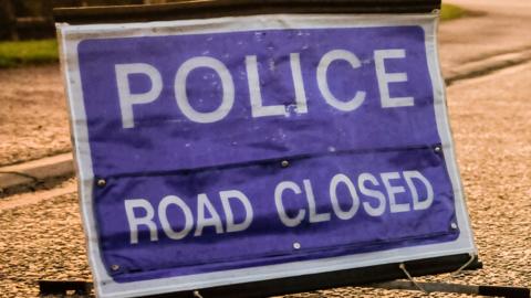 Road closed police sign