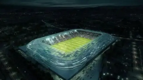 GAA The picture shows what it is envisaged the new Casement Park stadium will look like. It shows a stadium lit up at night surrounded by city streets and traffic. 