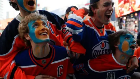 Fans react as the Oilers win in game six of the 2024 Stanley Cup Final between the Edmonton Oilers and Florida Panthers in Edmonton, Alberta, Canada, June 21, 2024