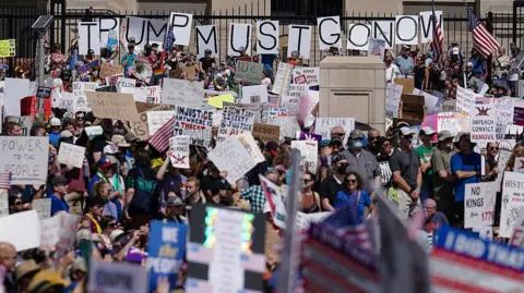 People take part in a "No Kings" protest at Liberty Plaza in Atlanta, Georgia, on 14 June 2025 as US President Donald Trump presides over a military parade in Washington, DC.