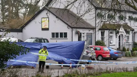 PA Media A crime scene outside a pub