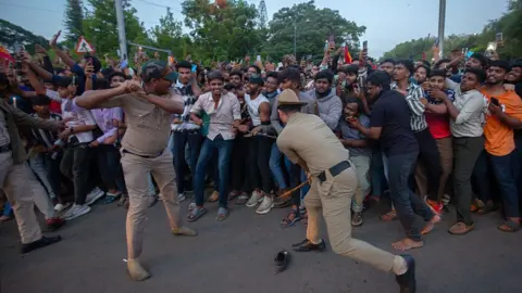 Getty Images Police officers try to control fans of the Royal Challengers Bengaluru (RCB) and get them to disperse from outside the M. Chinnaswamy Stadium on June 04, 2025 in Bengaluru, India.