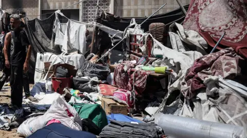 Reuters Palestinians inspect the remains of a tent destroyed by an Israeli strike in western Gaza City, near al-Shifa hospital (4 September 2025) 