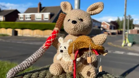 Yarnbombing Stapleford A crocheted kangaroo with a boomerang. 