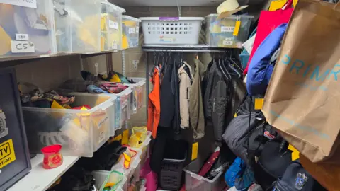 Oxford Bus Company A room at Oxford Bus Company's offices full of lost property on their vehicles. Bags, jackets and umbrellas can be seen.