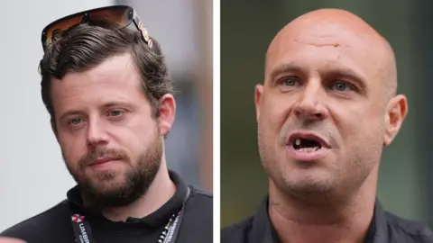 Keith Silk and Jonathan Glover. Keith Silk on the left has dark hair and a dark beard. He is wearing dark clothing with lanyards around his neck. Jonathan Glover on the right has a shaved head and is missing several teeth.