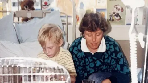 Family photo Colin in hospital with his mum 