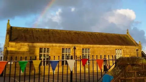 Lancashire County Council Rainbow in sky behind Goosnargh Oliverson's Church of England Primary School