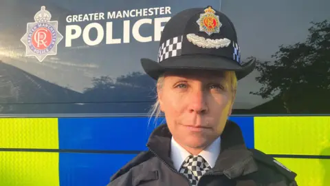 Assistant Chief Constable Steph Parker stands outside a police van