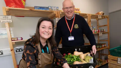 North Yorkshire Council Woman and man display food