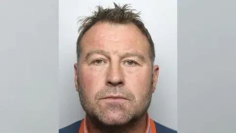 BBC A police mugshot of Tony Marsden