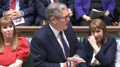 House of Commons/UK Parliament/PA Wire Screen grab of Chancellor of the Exchequer Rachel Reeves (right) crying as Prime Minister Sir Keir Starmer speaks during Prime Minister's Questions in the House of Commons, London