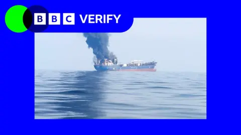 Smoke and flames plume from boat after it was hit