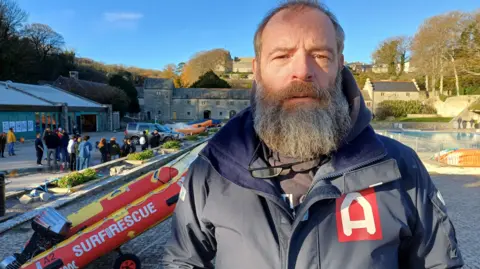 Robin Jenkins is the founder of the charity, Atlantic Pacific International Rescue and is pictured next to one of his small rescue boats. 