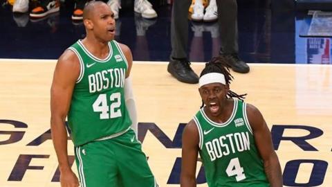 Al Horford and Jrue Holiday of the Boston Celtics celebrate